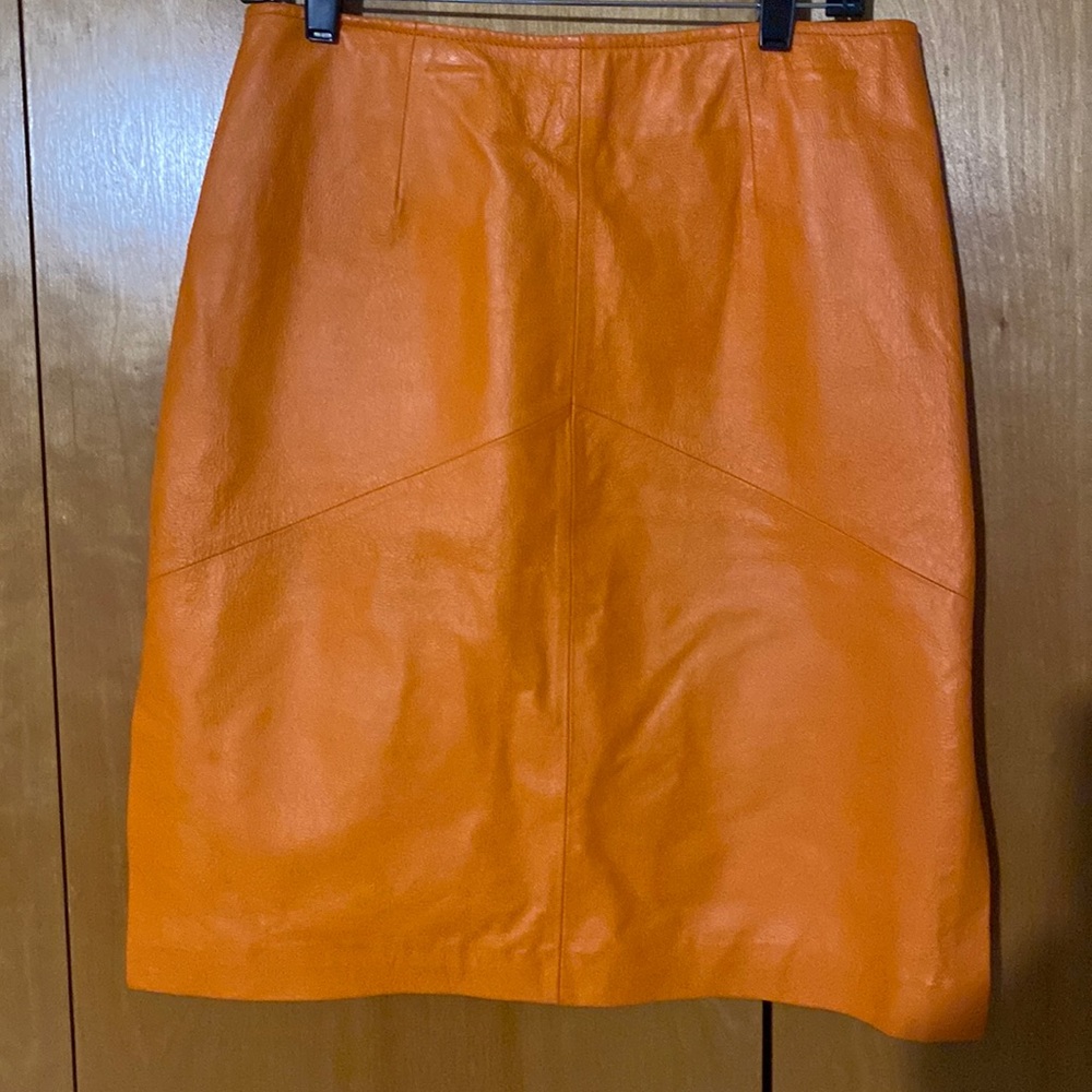 Smart and sexy orange leather skirt with side slits! Excellent Condition!